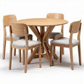 Round wooden dining table with four upholstered chairs in natural finish