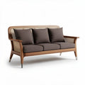 Natural wood frame three-seater sofa with dark grey cushions and rattan accents